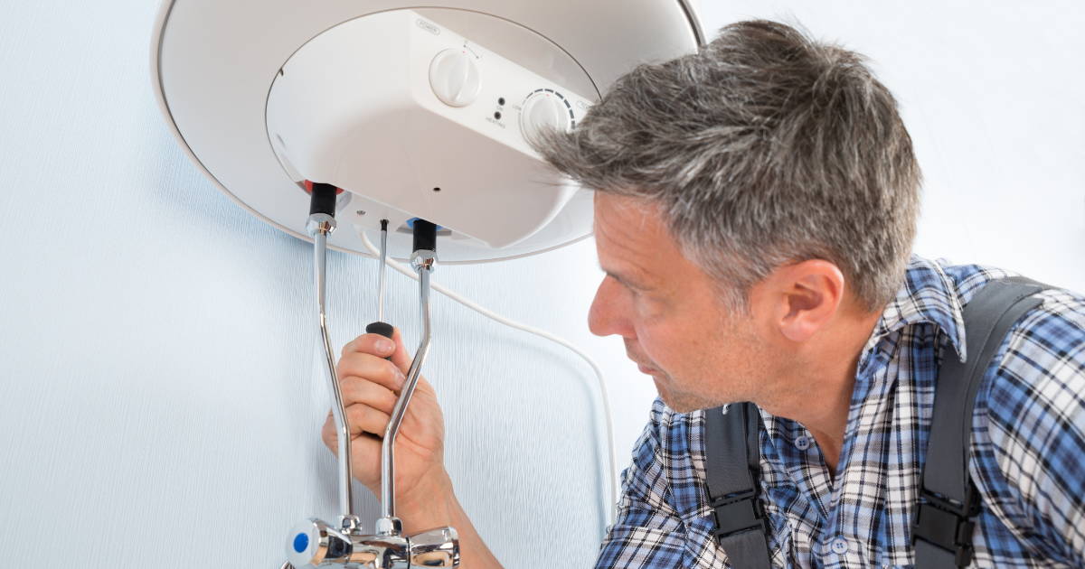 plumber fixing a water heater